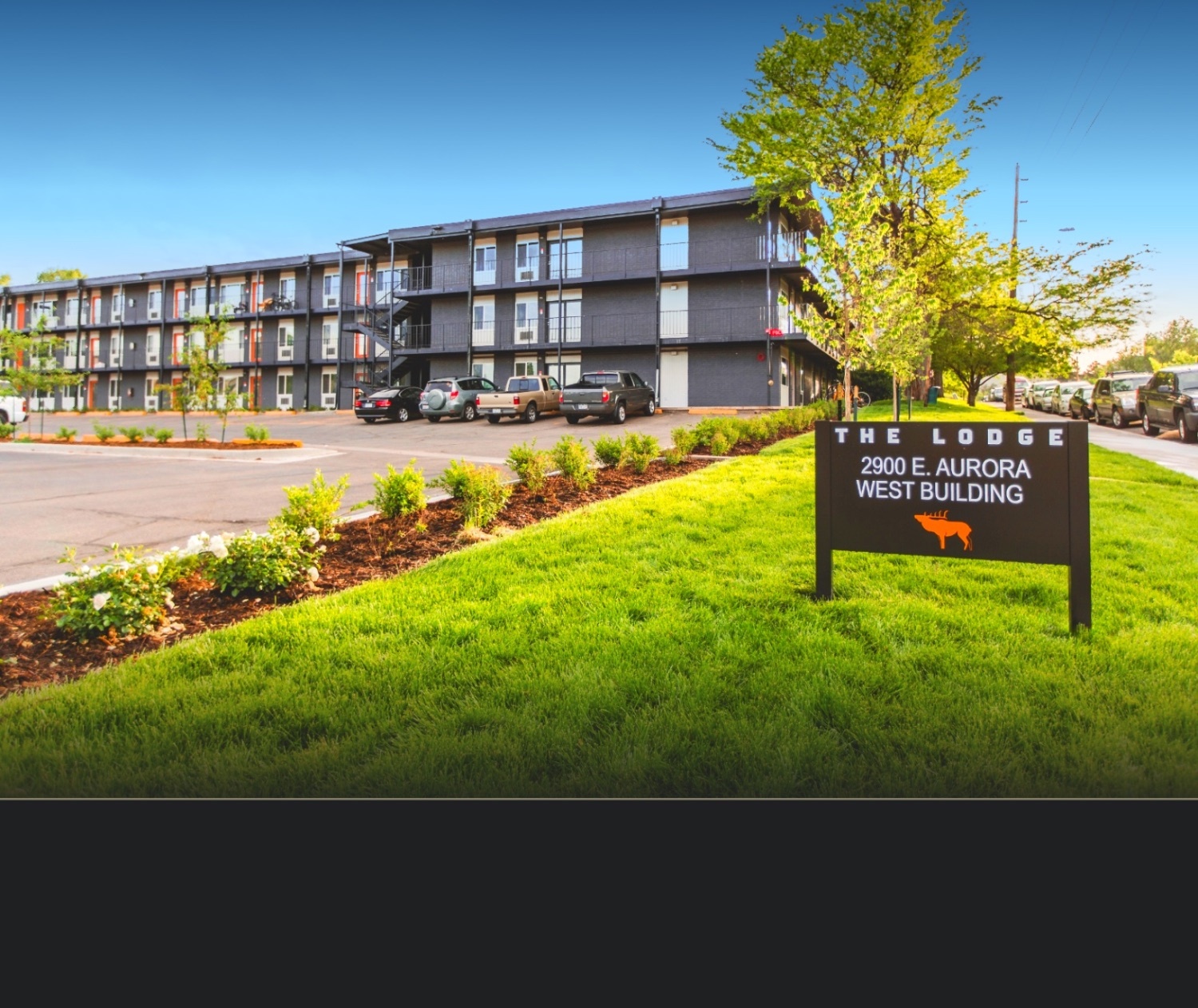 The Lodge property sign at 2900 E. Aurora Avenue